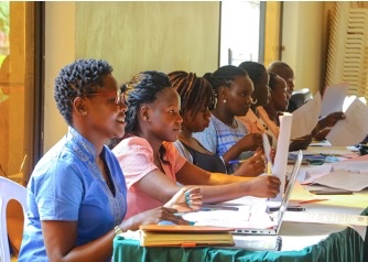 MIFUMI Movement Builders (old staff and new recruits) enjoy an invigorating discussion on domestic violence (OR GBV) in Tororo, Uganda in February 2022